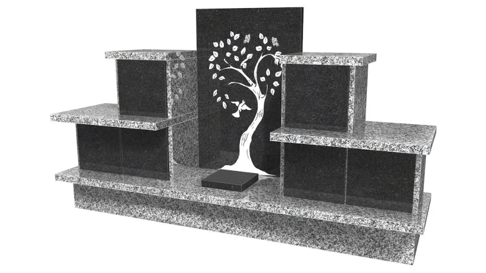 Monument funéraire columbarium en granit gris avec gravure d'arbre de vie.